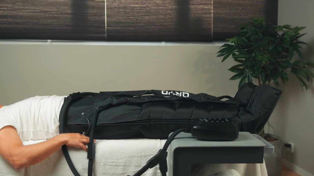 Client in compression trousers at a clinic